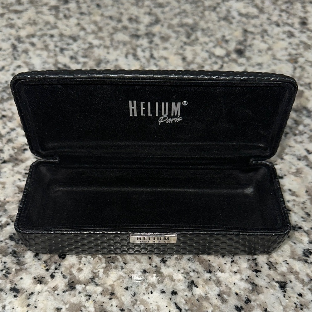 HELIUM PARIS Black eyeglass hard case. Velvet lining with Silver branding.